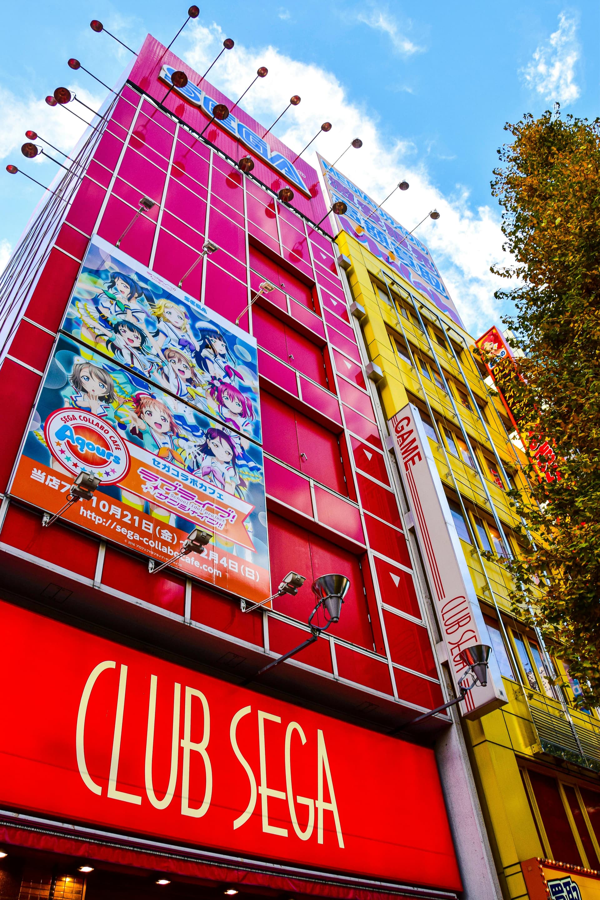 Club Sega arcade building in Akihabara with Love Live anime promotion banner