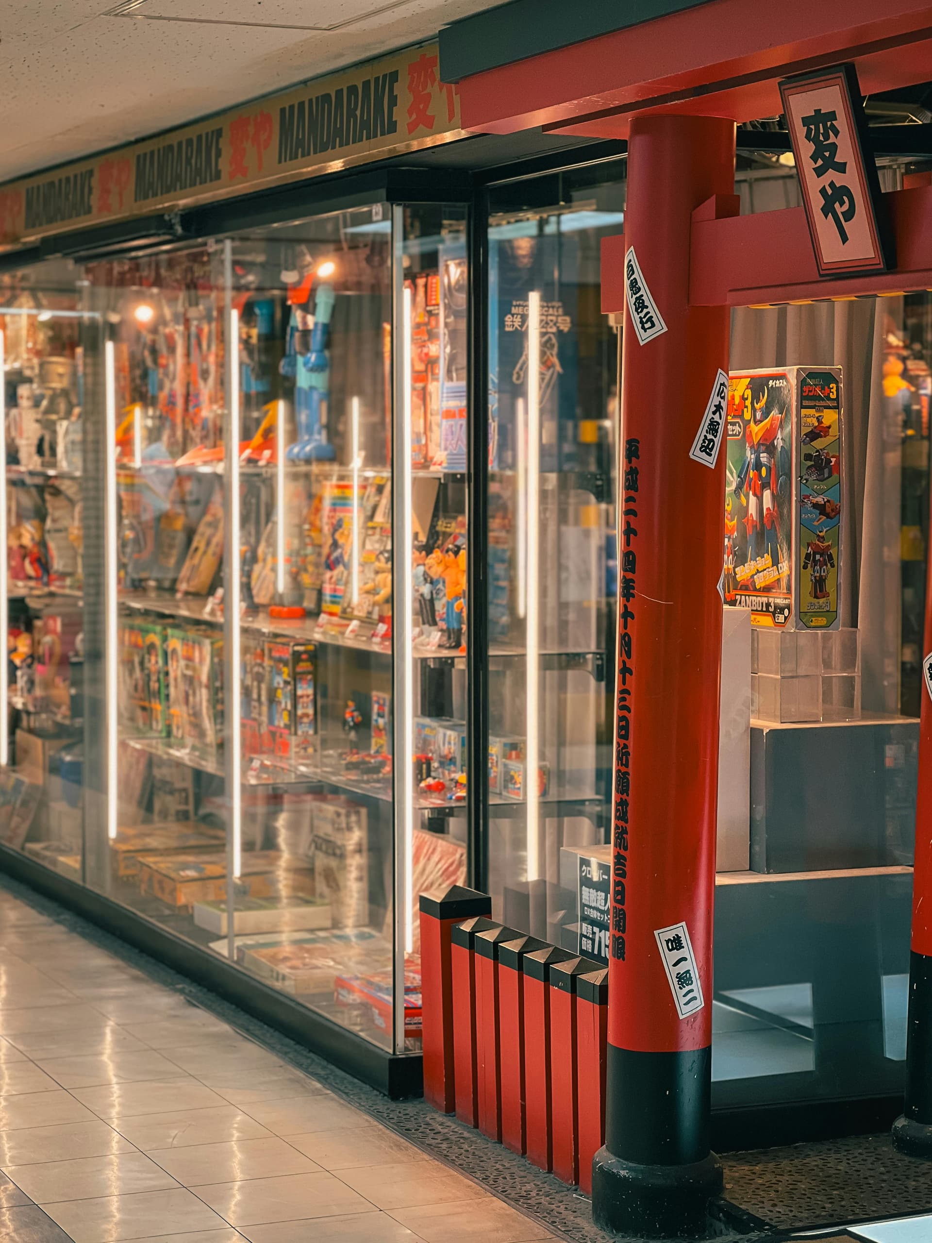 Mandarake rare collectibles display cases in Nakano Broadway with vintage mecha toys