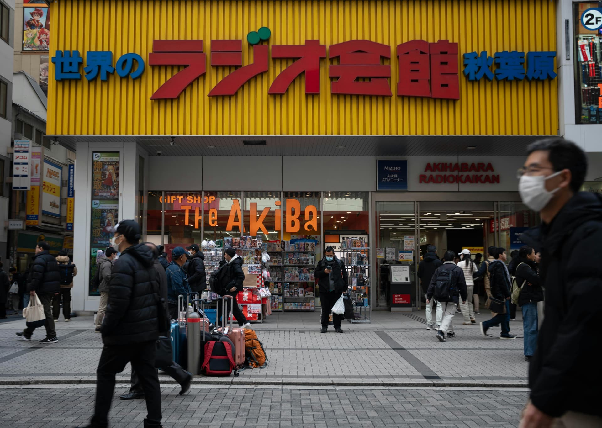 Radio Kaikan building entrance in Akihabara with shoppers and anime merchandise displays