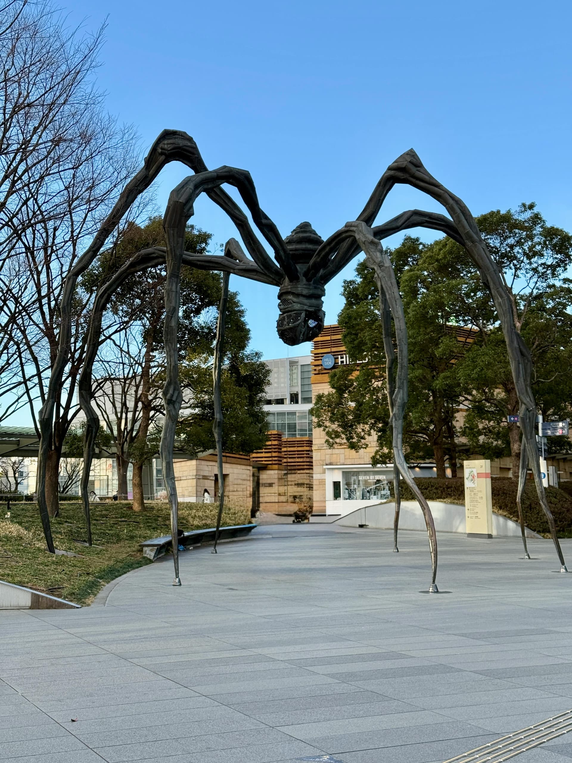 Louise Bourgeois Maman spider sculpture at Roppongi Hills plaza with Mori Art Museum behind