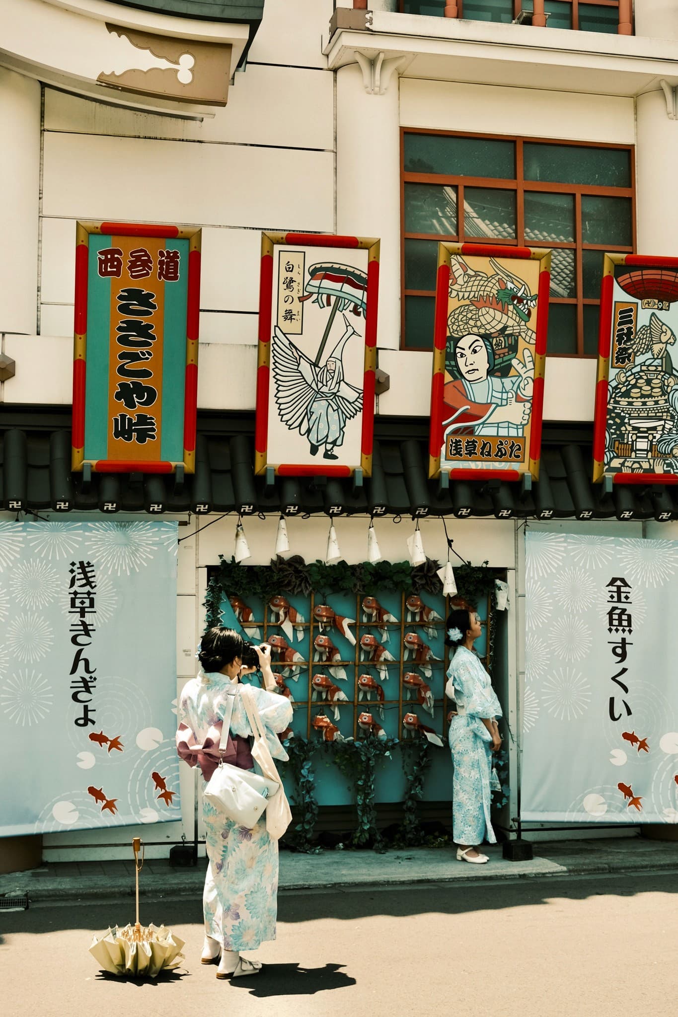 Quiet Ura-Asakusa backstreet with weathered shopfronts and faded signage