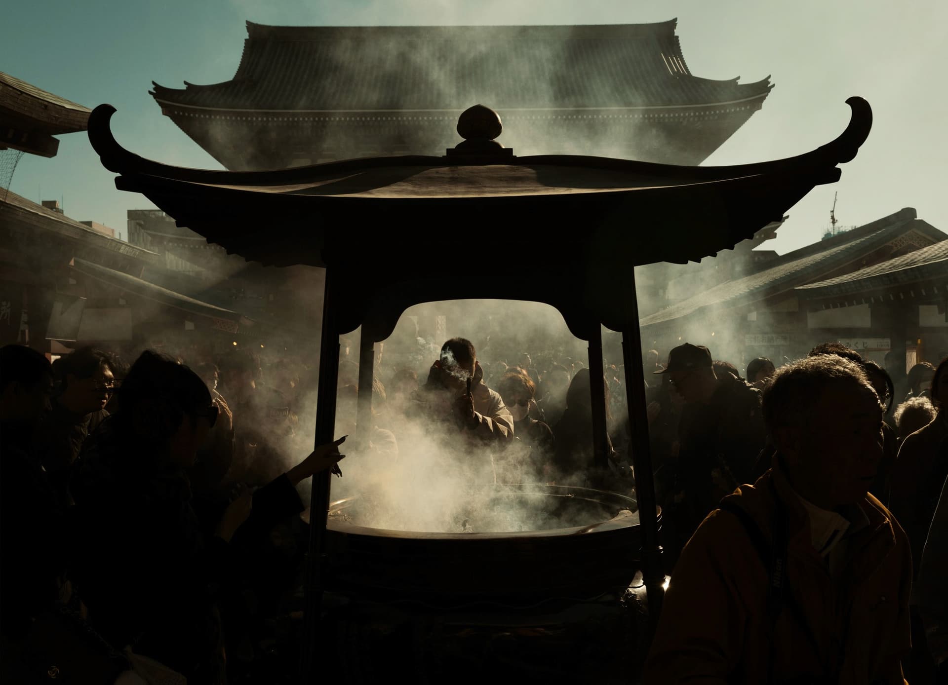 Sensoji Temple main hall with incense smoke rising from the giant cauldron