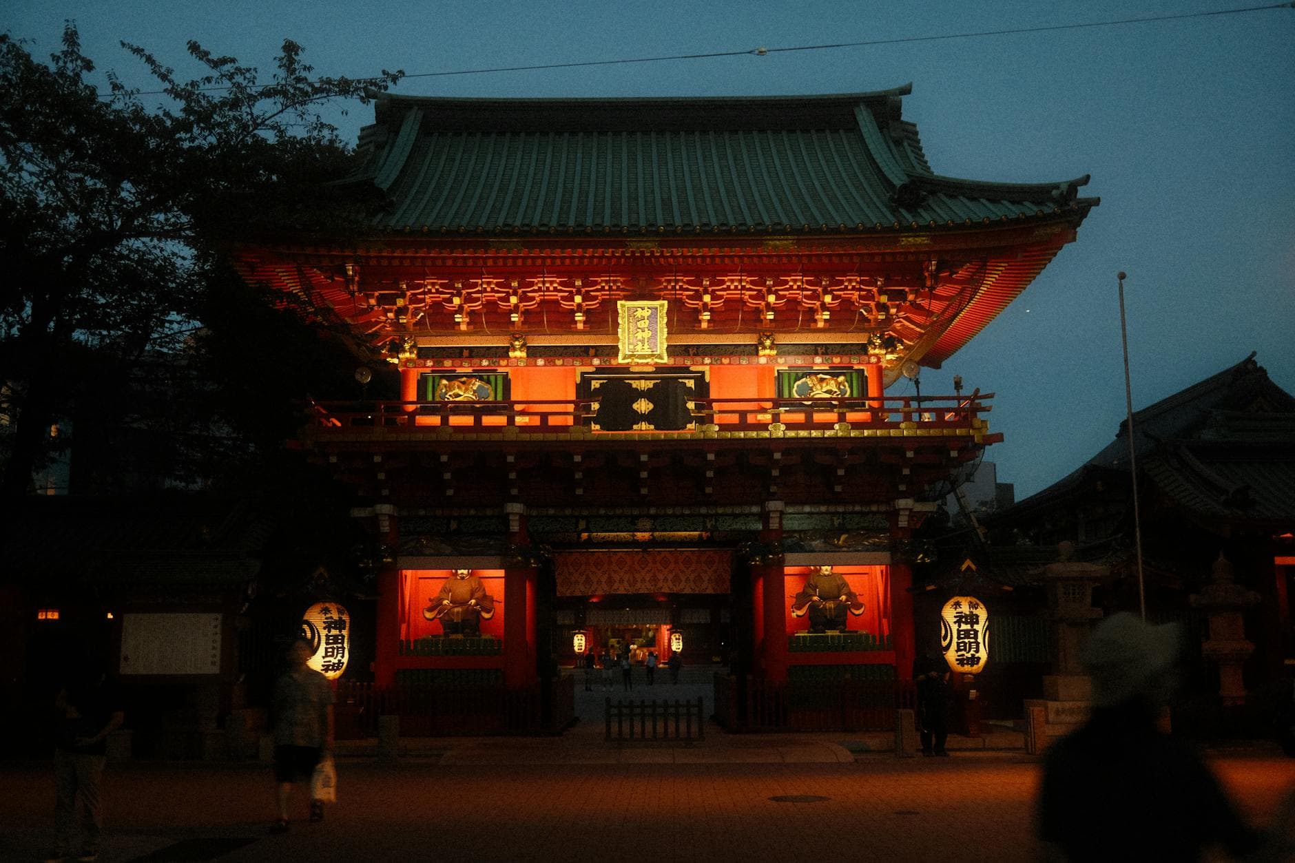 Kanda Myojin Shrine entrance glowing with vibrant lanterns at evening