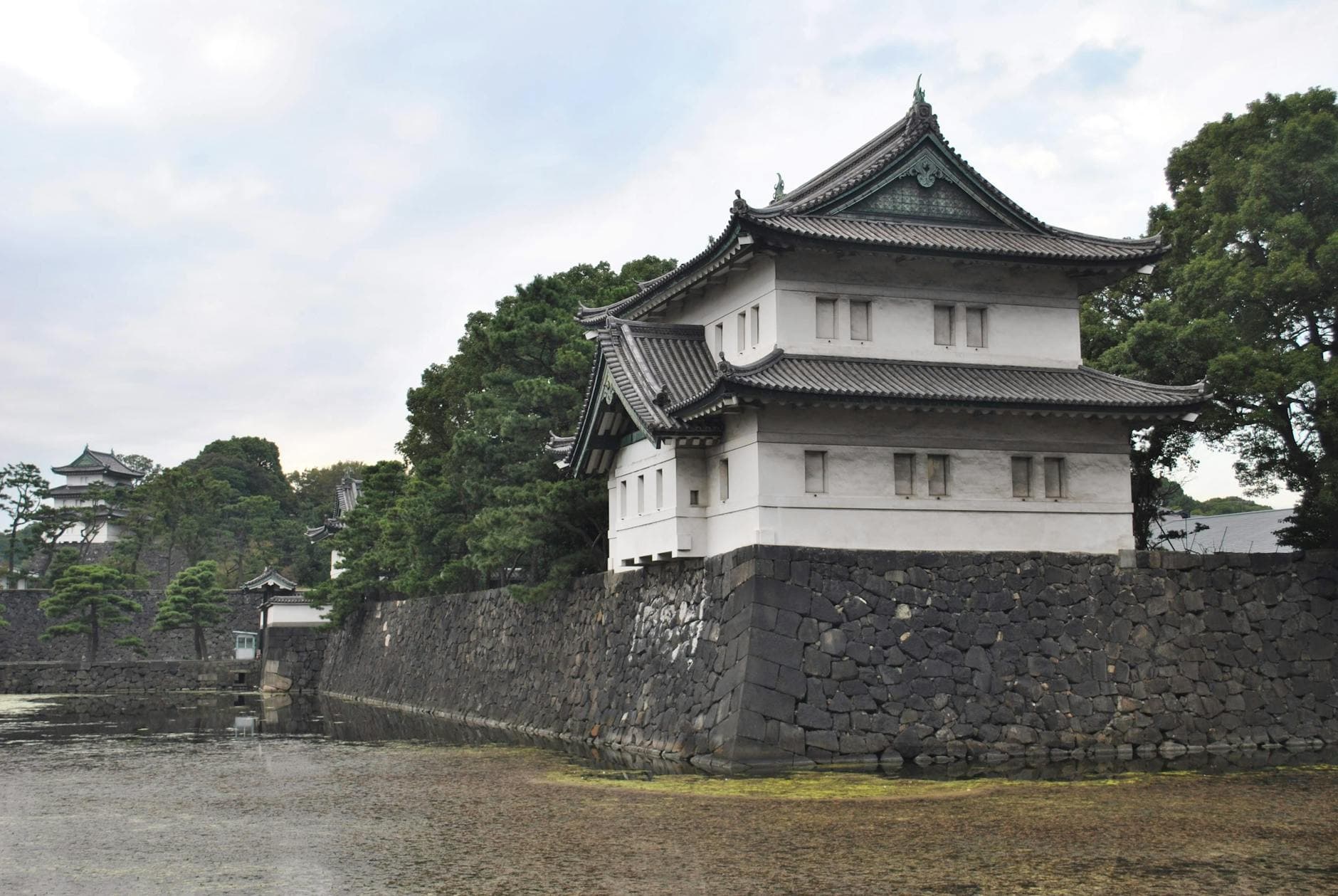Exterior of Tokyo Imperial Palace with stone walls and greenery