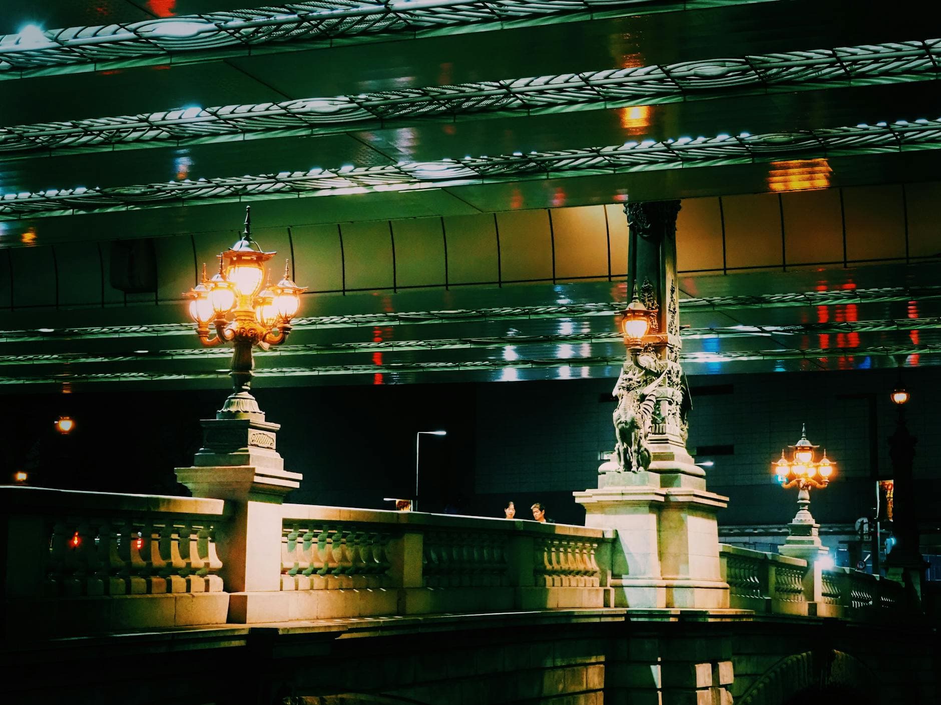 Nihonbashi Bridge in Tokyo at night with ornate lamps illuminated
