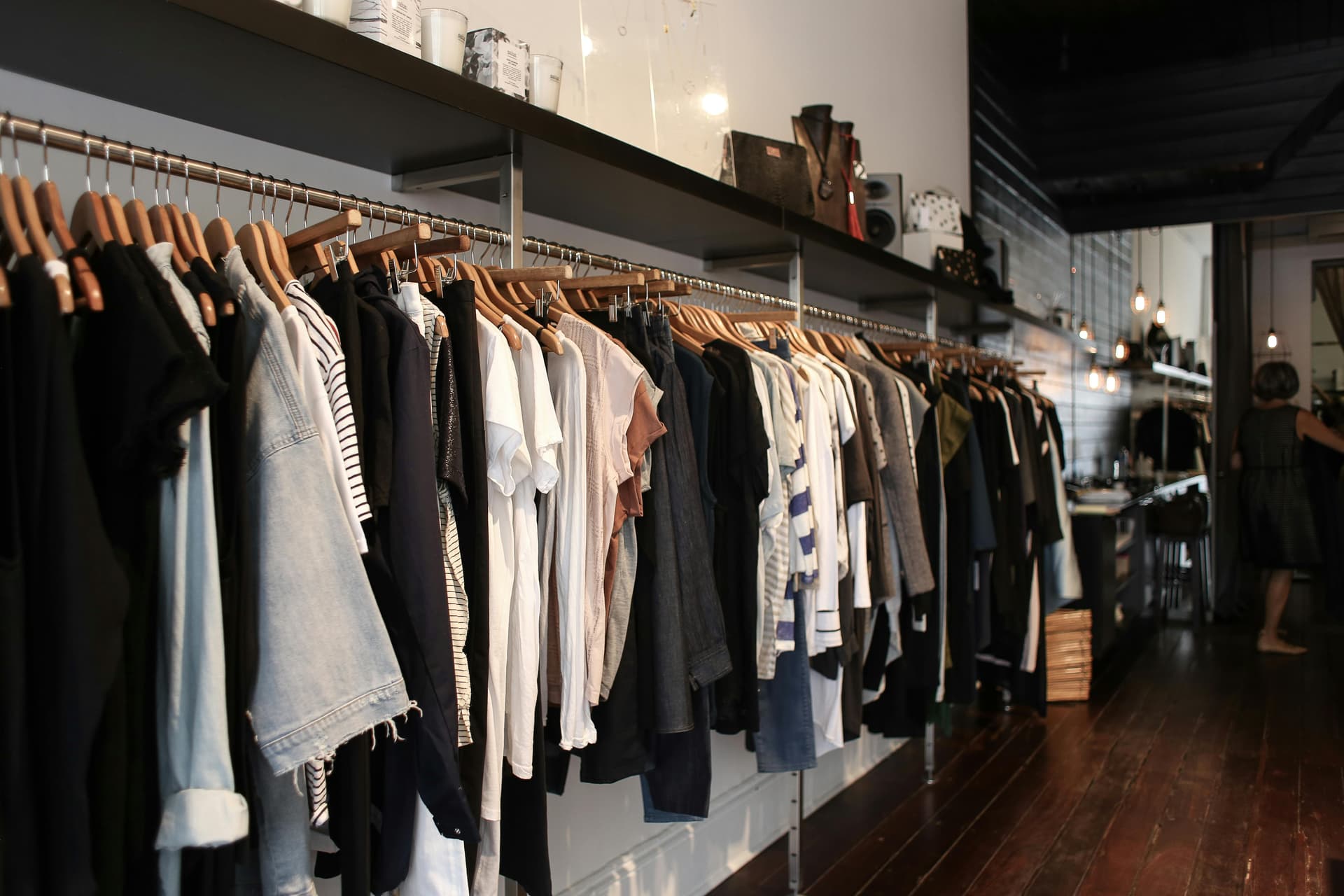 Curated vintage clothing rack at a Harajuku designer resale shop