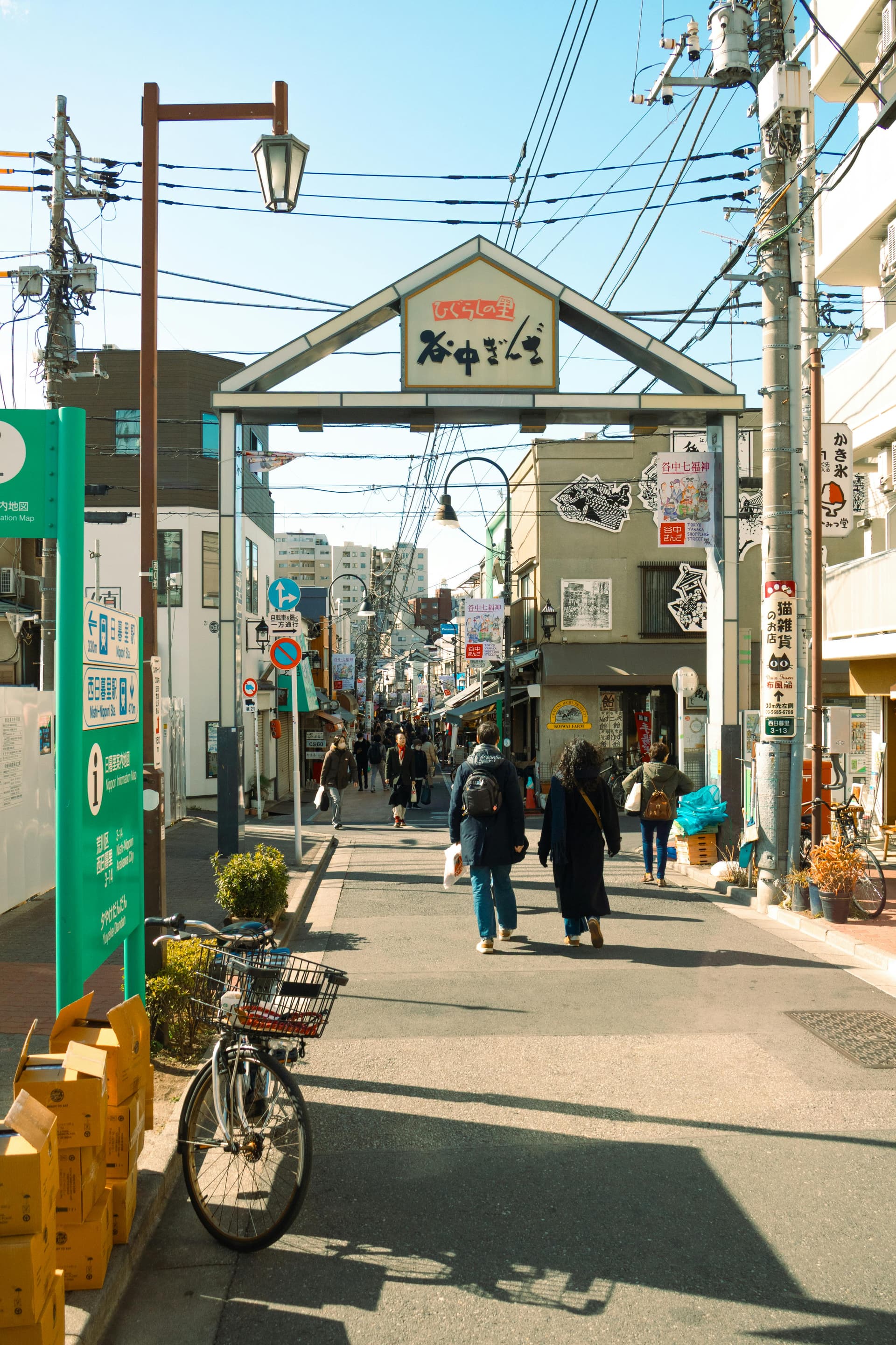 Narrow alley of Harmonica Yokocho with tiny bar fronts and hanging lanterns