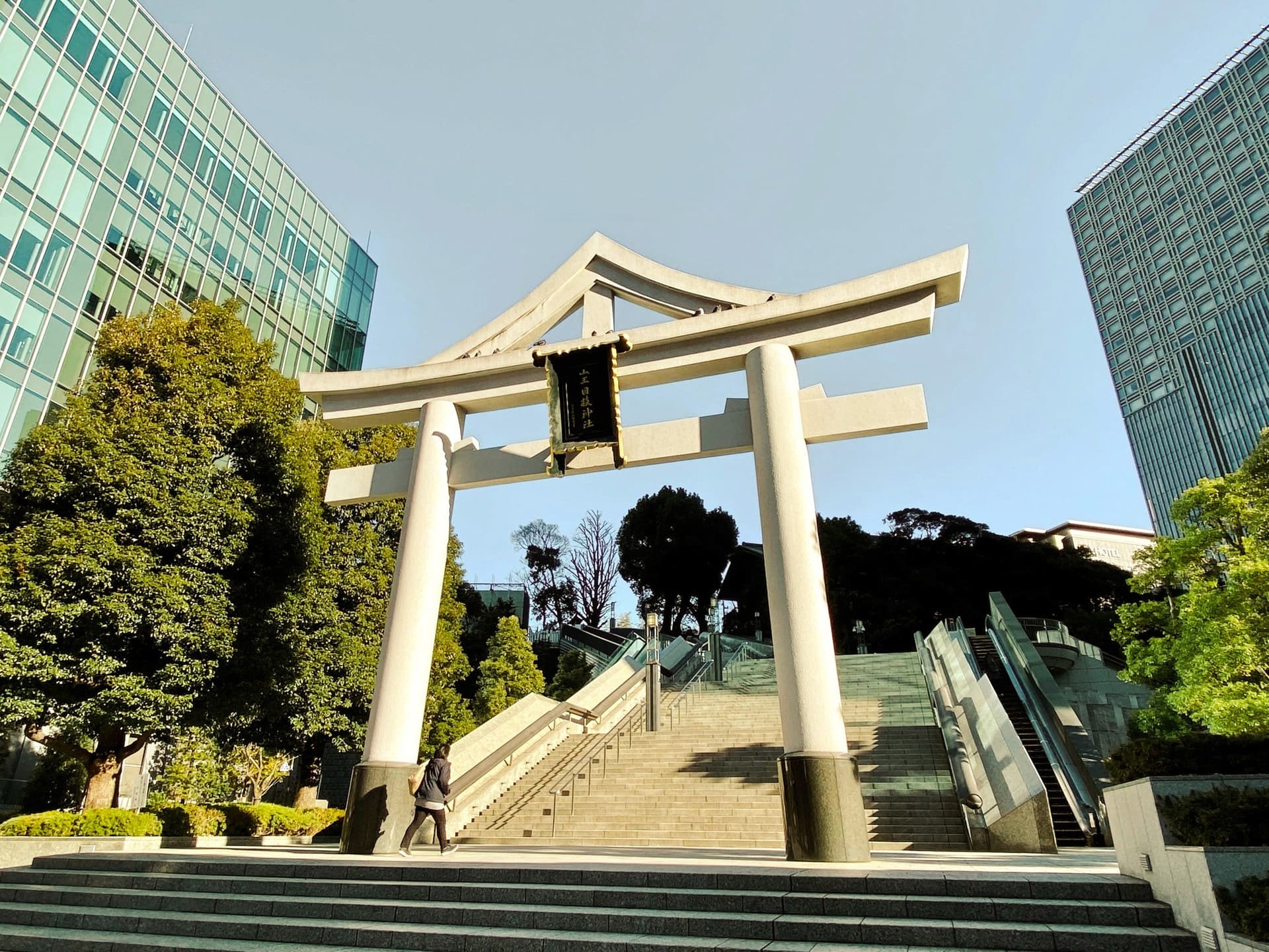 Tree-lined path around Inokashira Pond with pedal boats