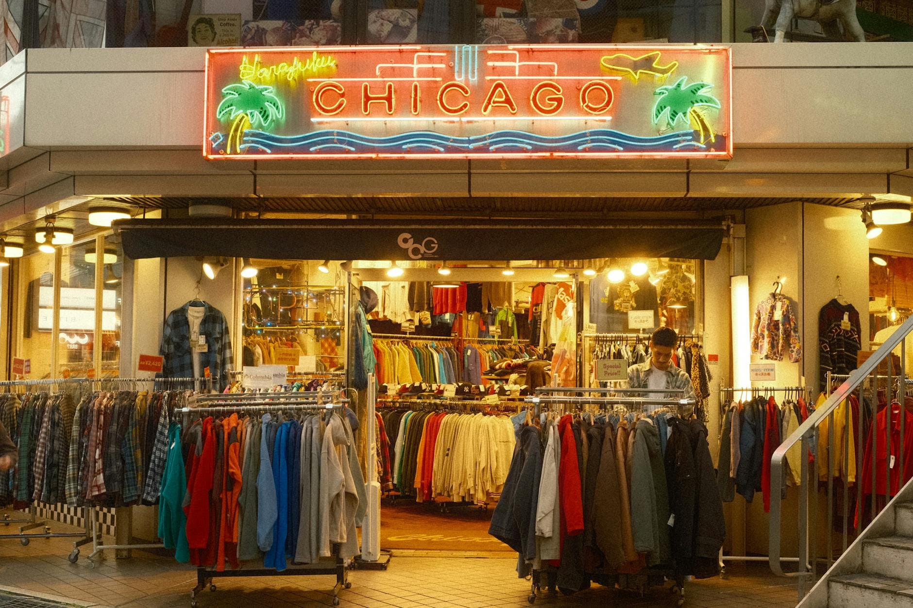 Neon-lit vintage clothing store Chicago on a bustling Tokyo street at night