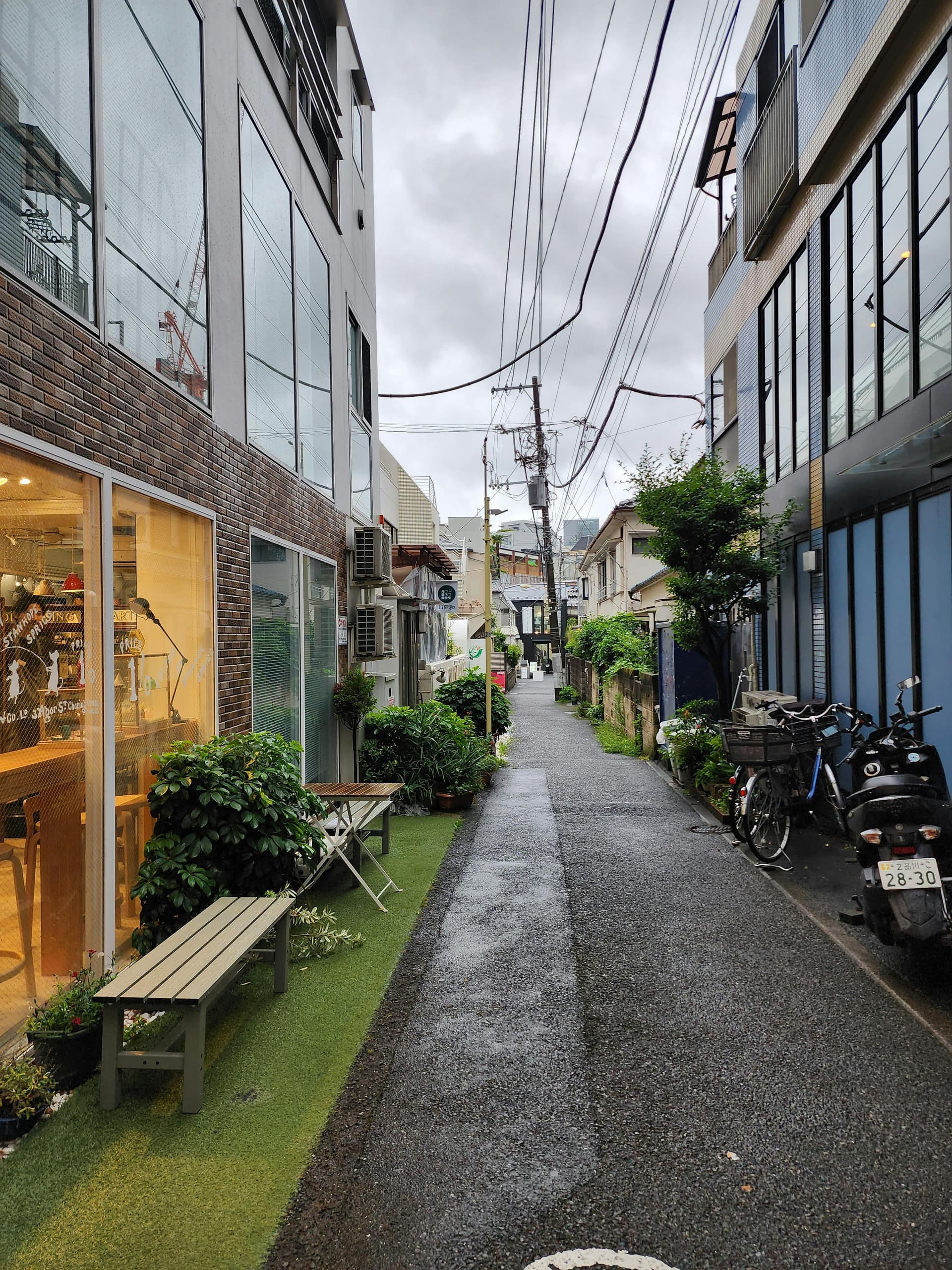 Quiet Tokyo backstreet with independent boutiques and cafe storefronts