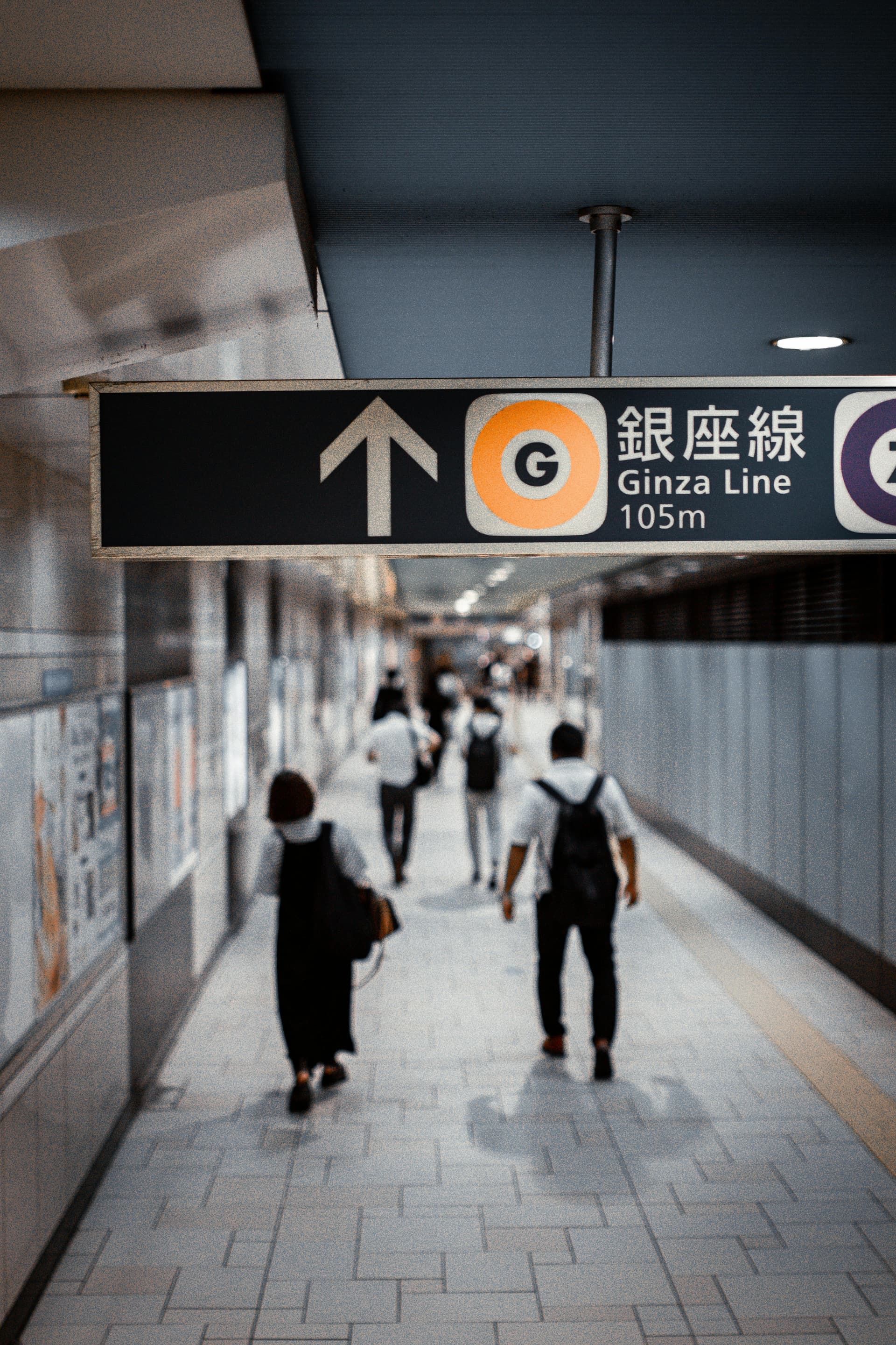 Ginza Line subway sign with shoppers heading toward Tokyo's premier shopping district