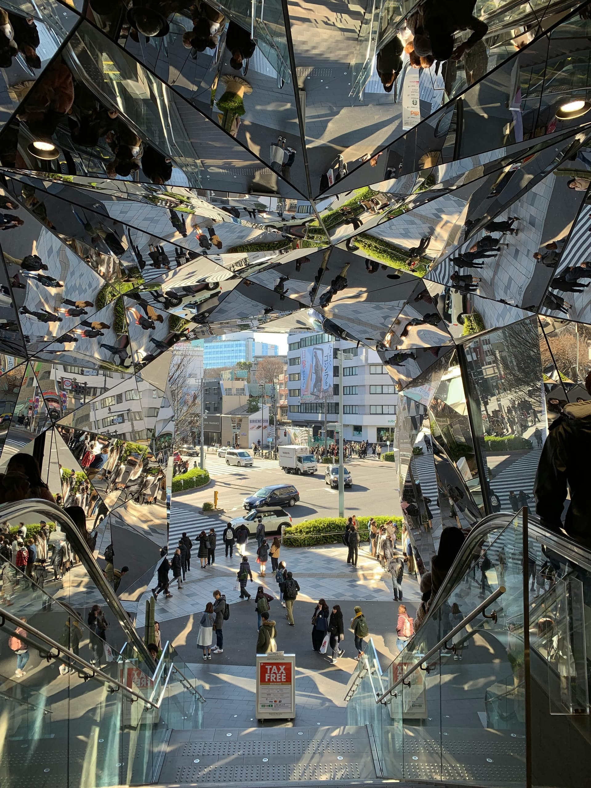 Kaleidoscopic mirrored entrance tunnel at a Harajuku shopping complex