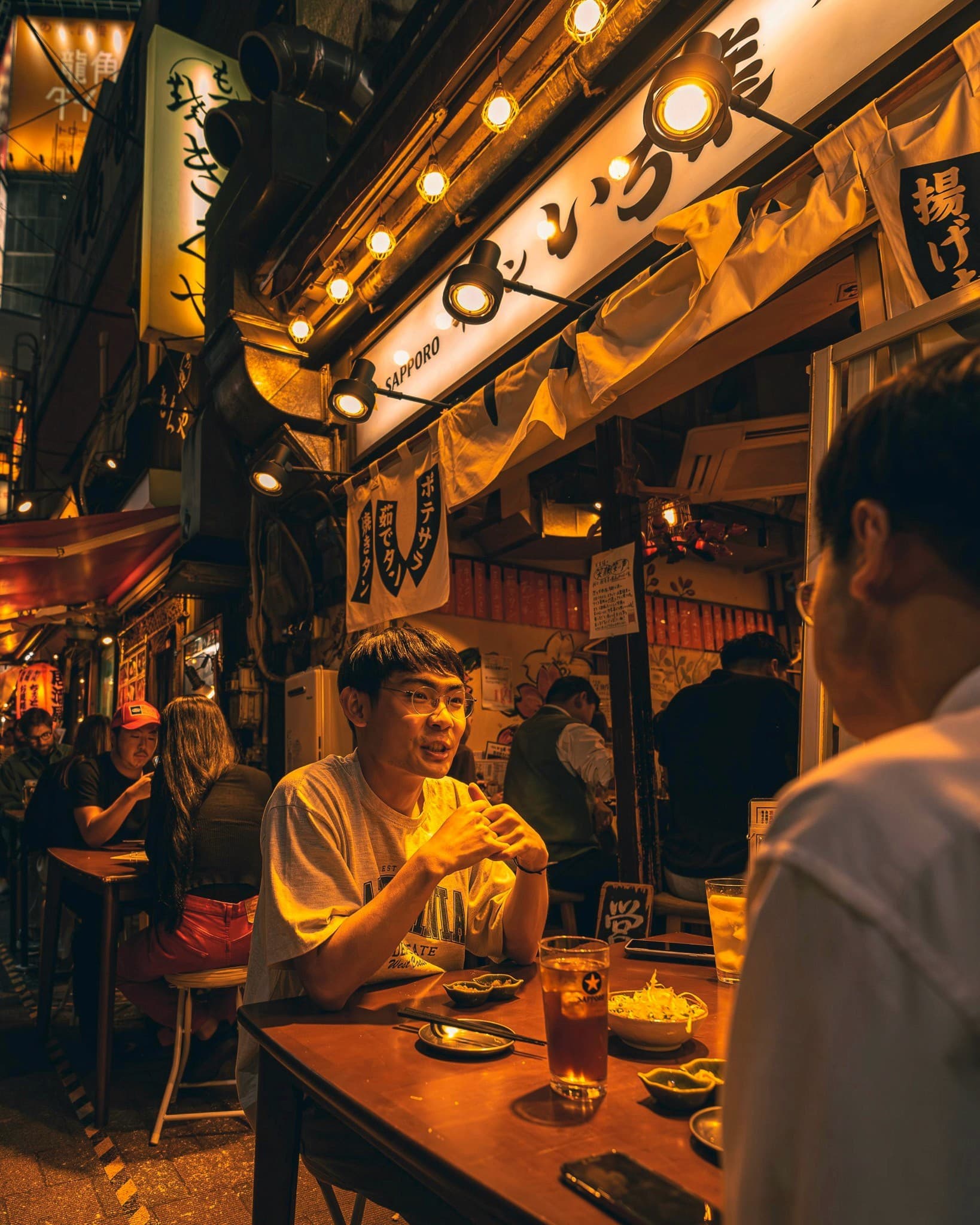 Outdoor evening drinking at alleyway bar