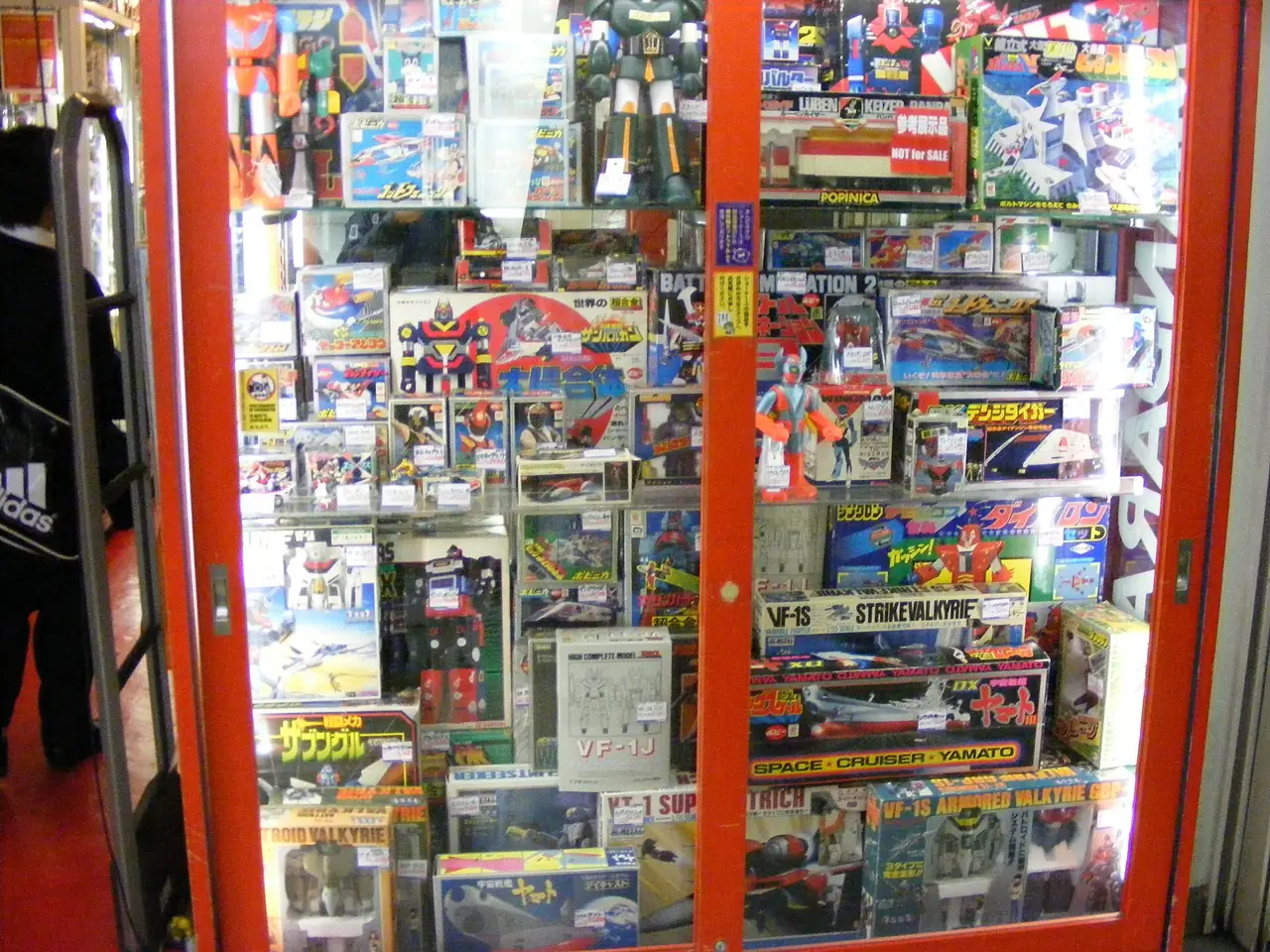 Shop window in Nakano Broadway packed with boxed vintage robot and anime toys
