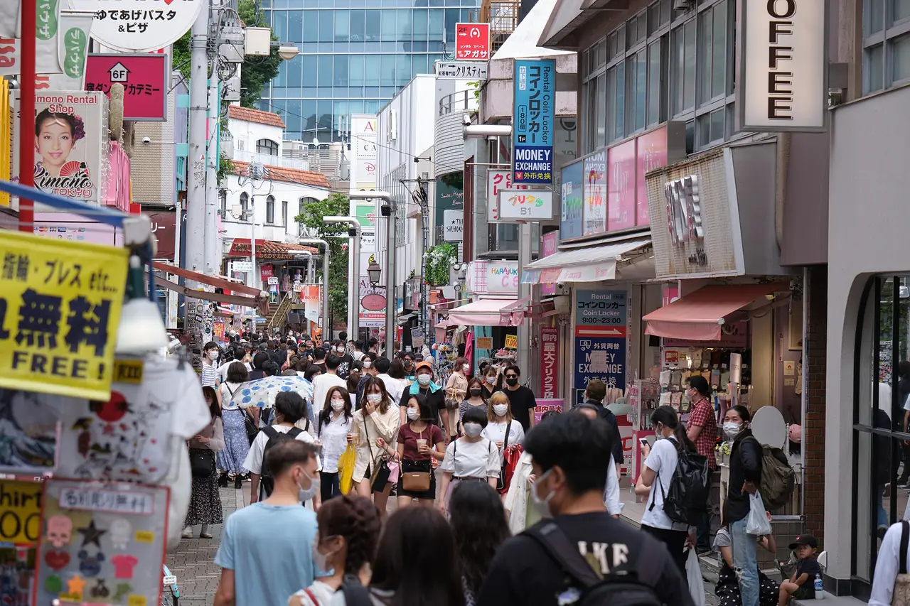 Weekend crowds walking down Takeshita Street in Harajuku past fashion and souvenir shops