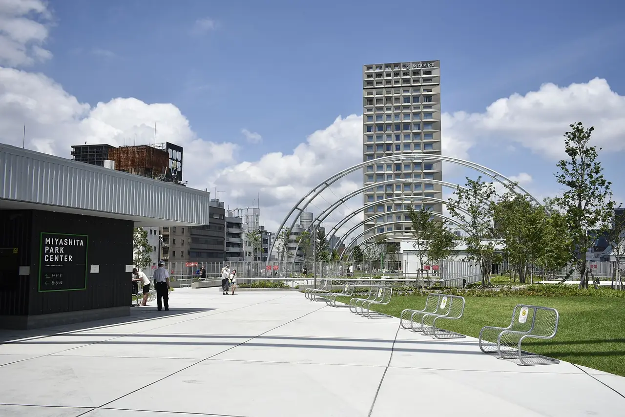 The rooftop lawn and steel arches of Miyashita Park above Meiji-dori in Shibuya