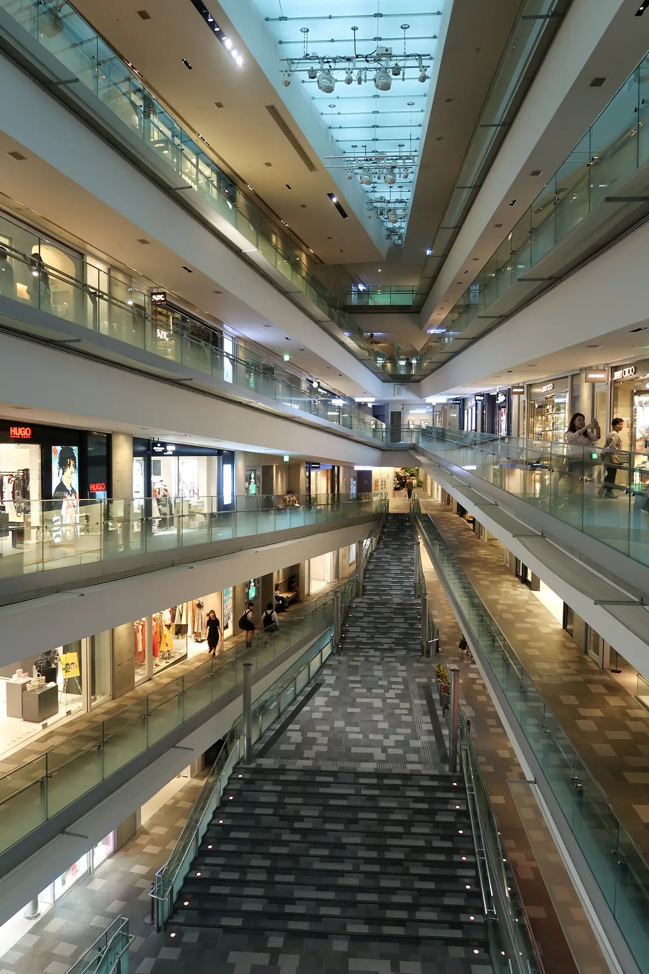 Open atrium and sloping walkways inside Omotesando Hills