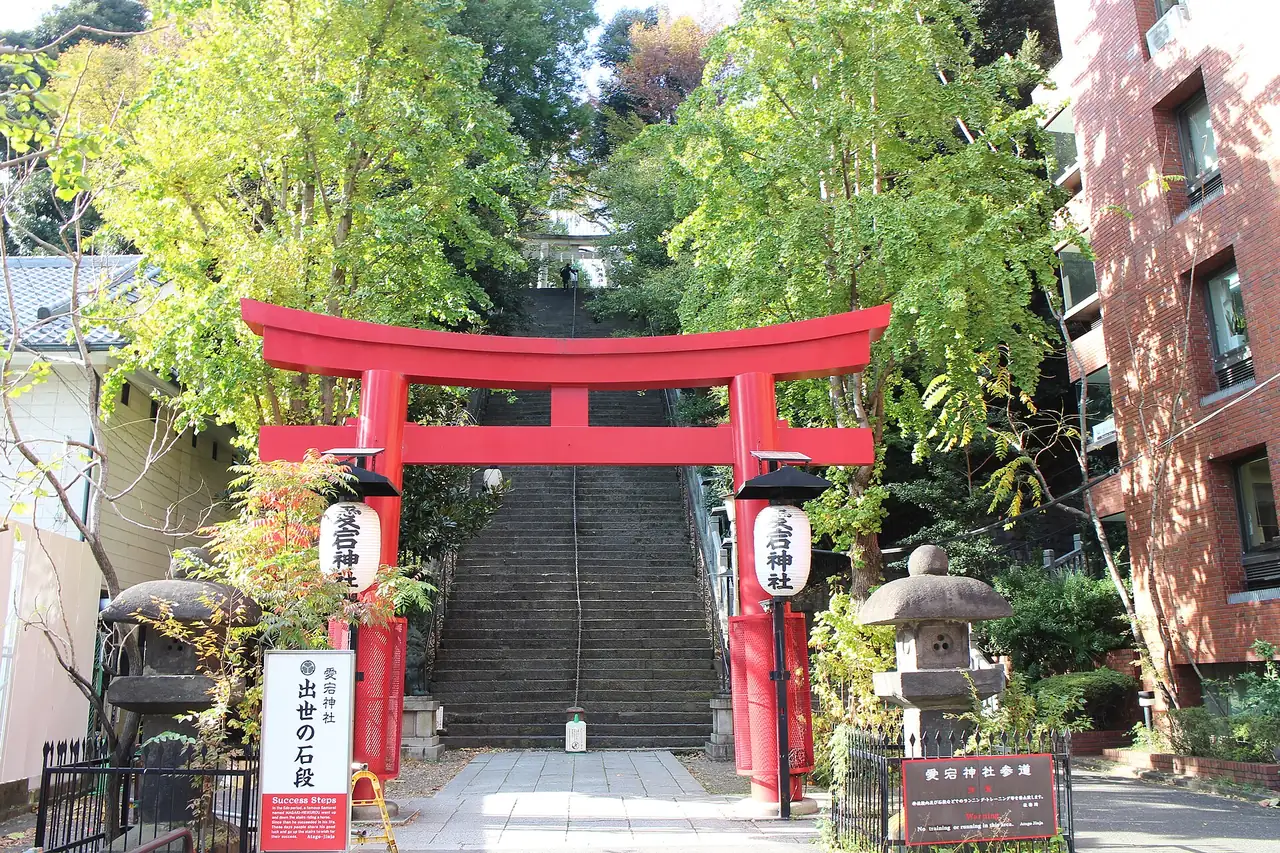 Red torii at the foot of the steep stone Steps to Success at Atago Shrine