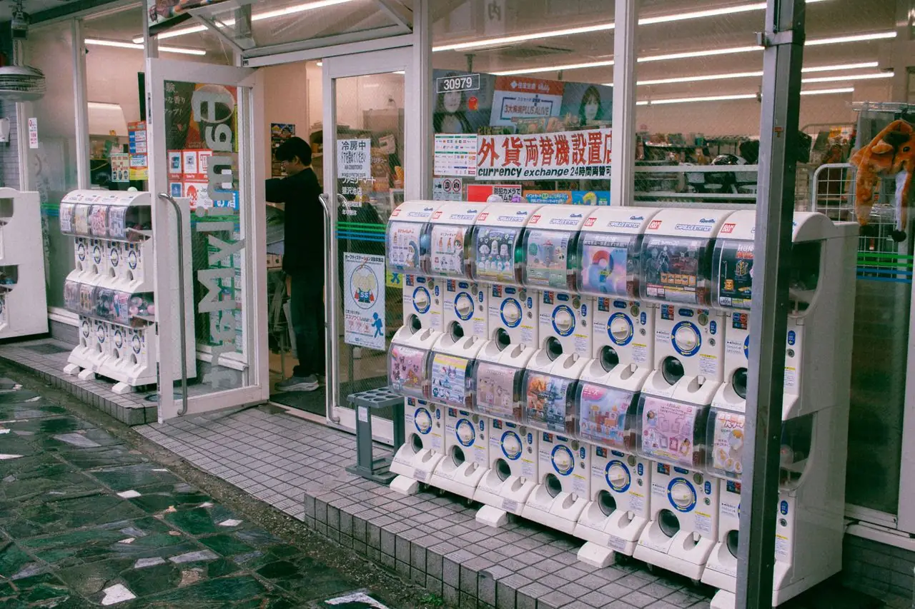 Rows of gachapon capsule toy machines outside a shop in Japan
