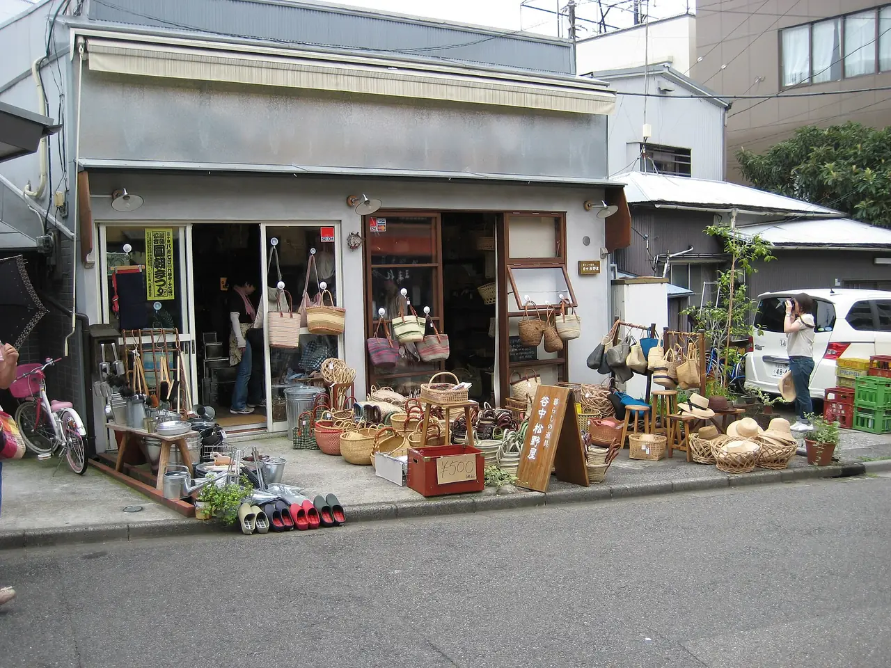Baskets and household goods set out in front of Yanaka Matsunoya, a small shop in Yanaka