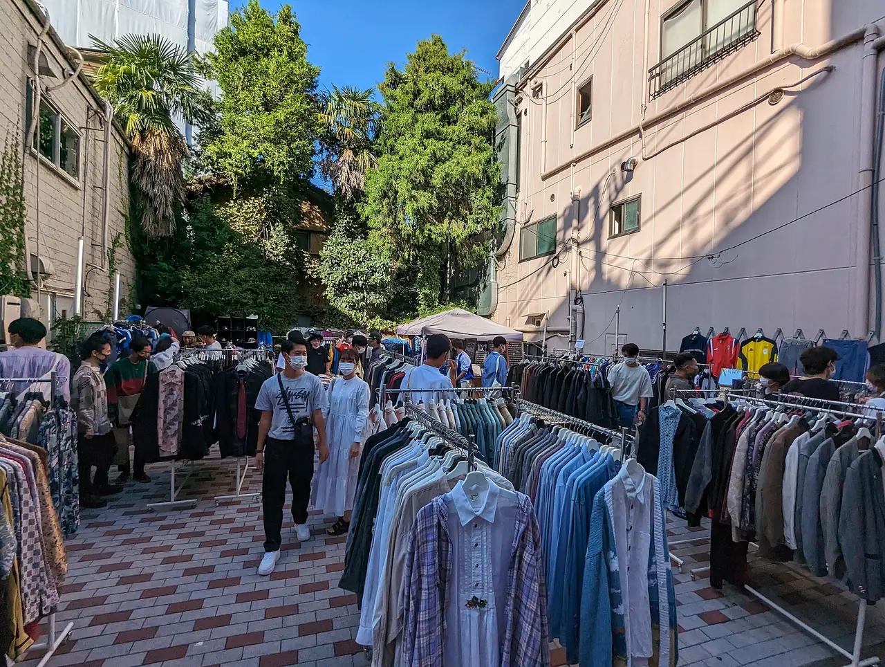 Outdoor racks of secondhand shirts and jackets for sale in Shimokitazawa