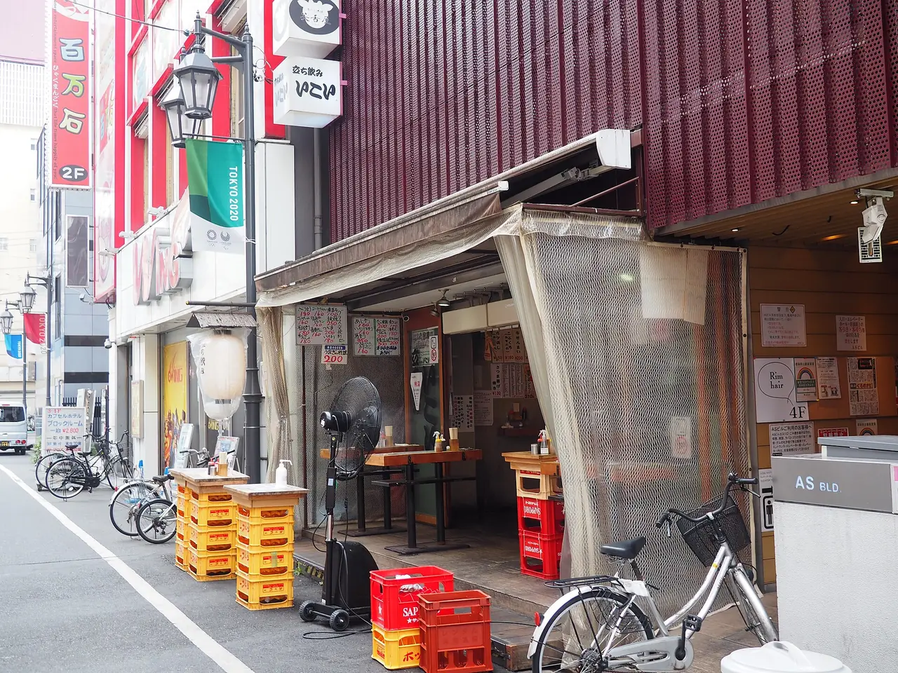 Beer crate tables outside the Ikoi standing bar in Akabane, Tokyo