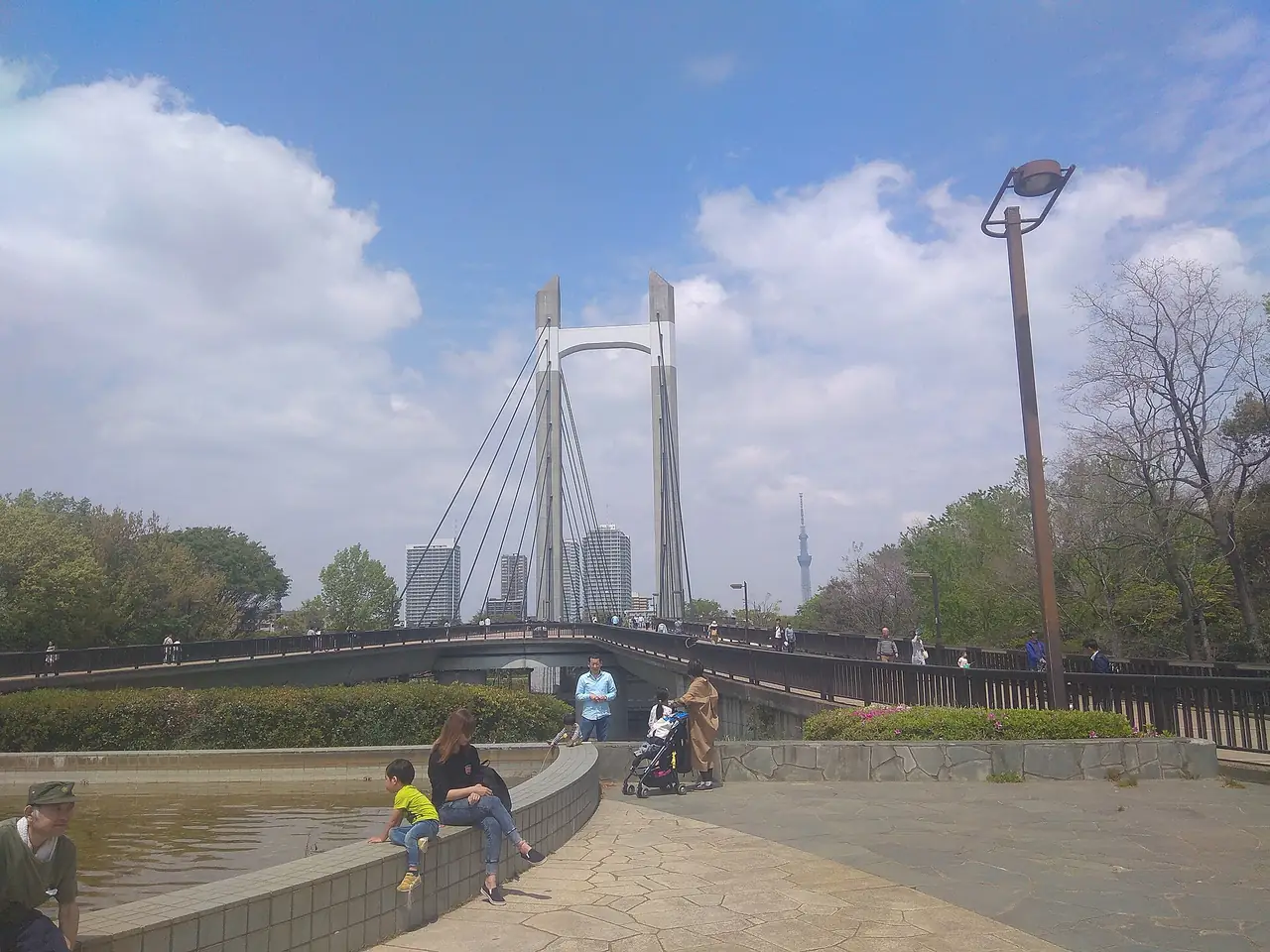 Cable-stayed footbridge in Kiba Park with Tokyo Skytree in the distance