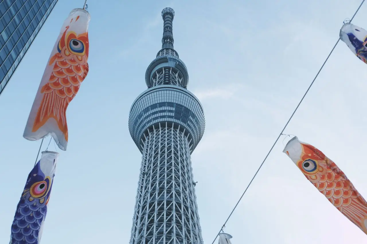 Koinobori carp streamers strung on lines below Tokyo Skytree for Children's Day