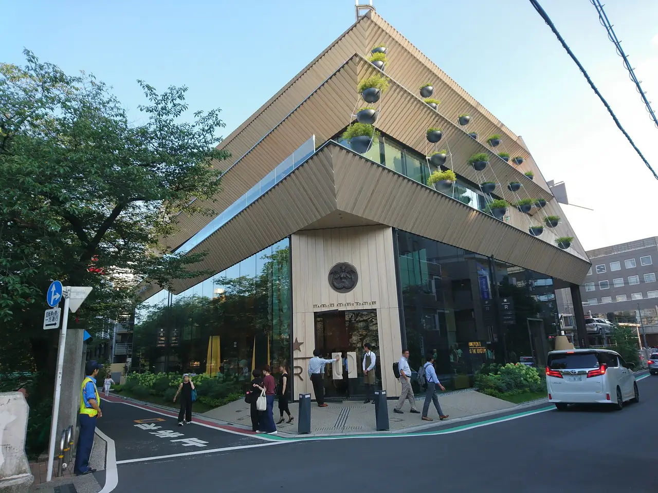 Kengo Kuma's timber-clad Starbucks Reserve Roastery building on a Nakameguro street corner