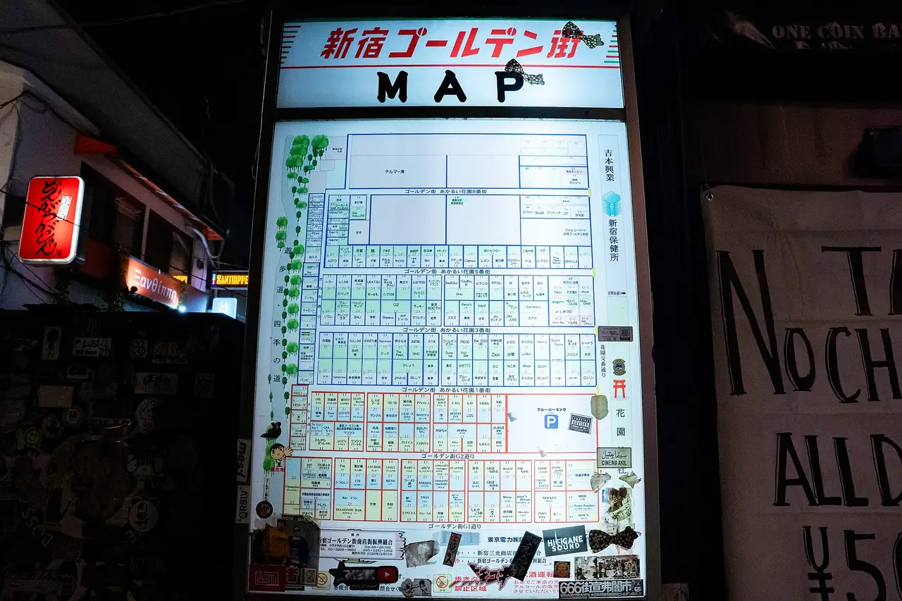 Illuminated map board showing the tightly packed bars of Shinjuku Golden Gai at night