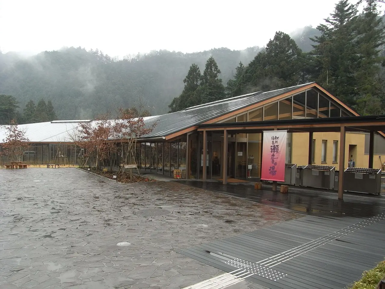 The Seoto-no-yu hot spring building under misty hills in the Akigawa Valley