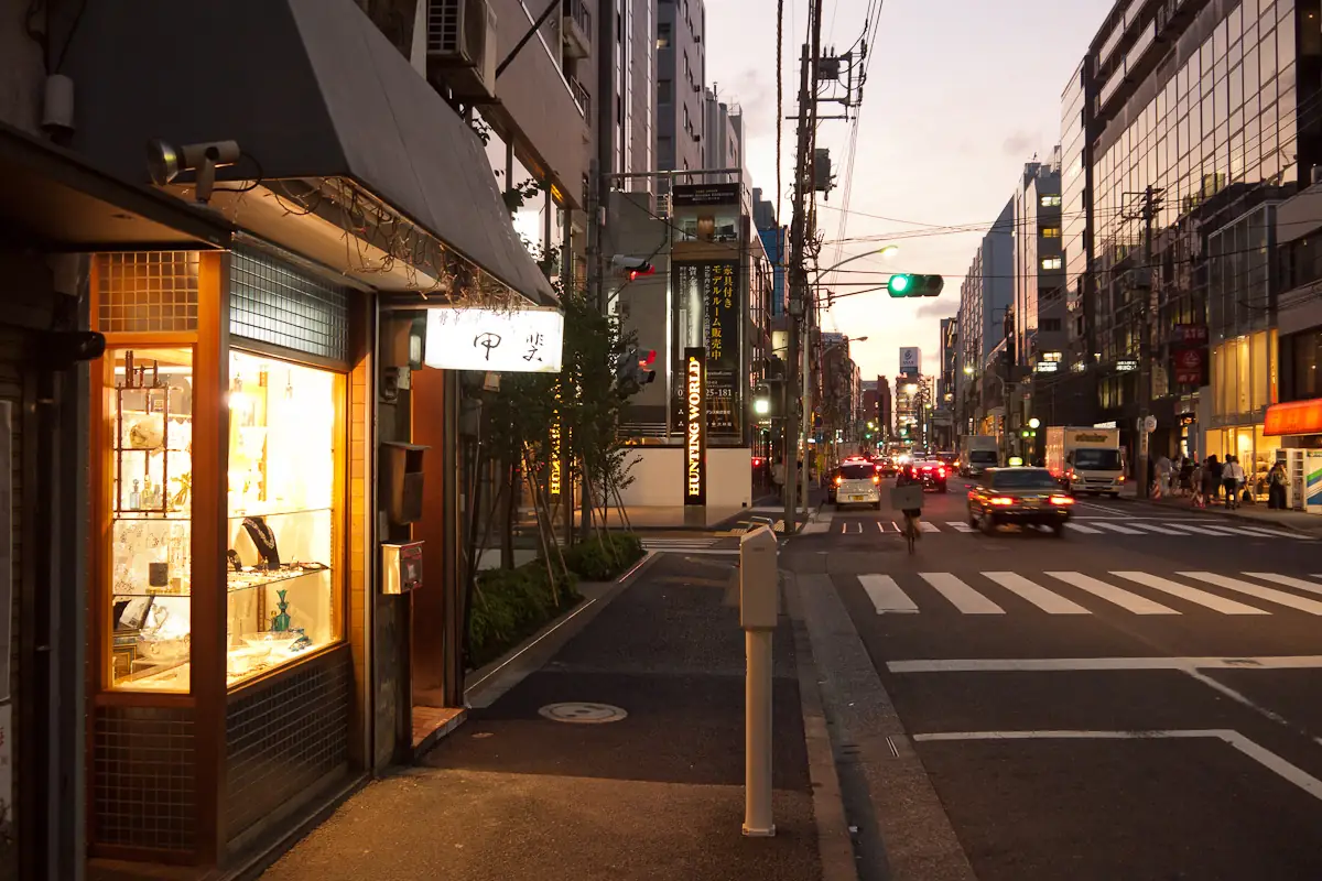 Lit shop window on Kotto-dori in Minami-Aoyama at dusk