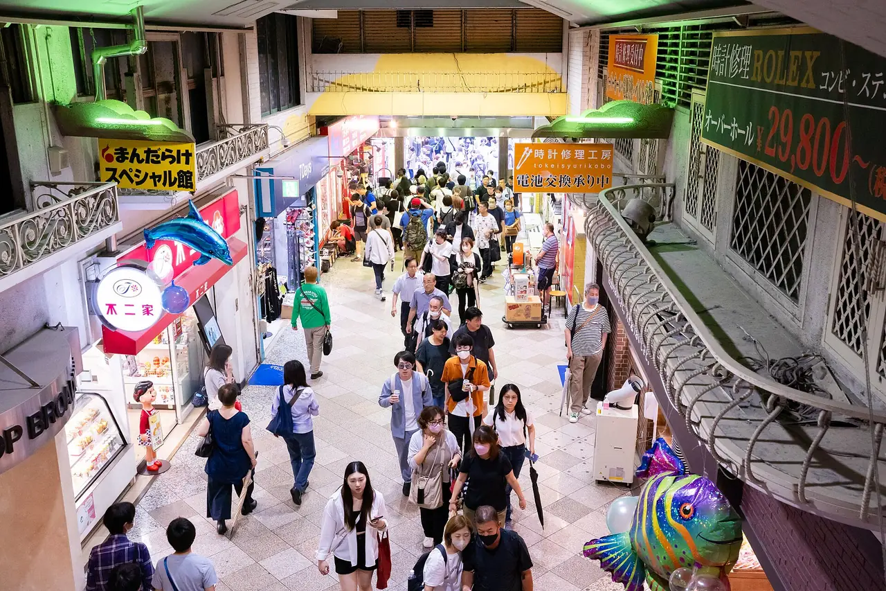 Shoppers crowding the entrance corridor of Nakano Broadway seen from above